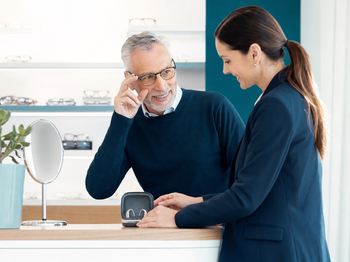 Client reviewing vision and hearing options with a specialist